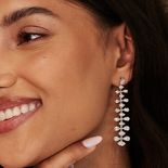 A woman with a long earring.
